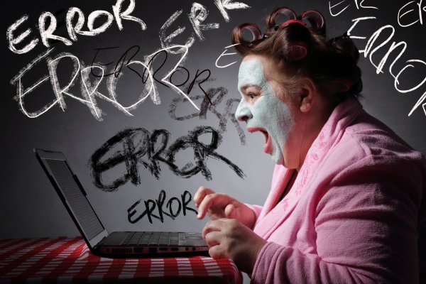 registry cleaners software benefits frustrated woman with face mask on yelling at laptop error written on walls